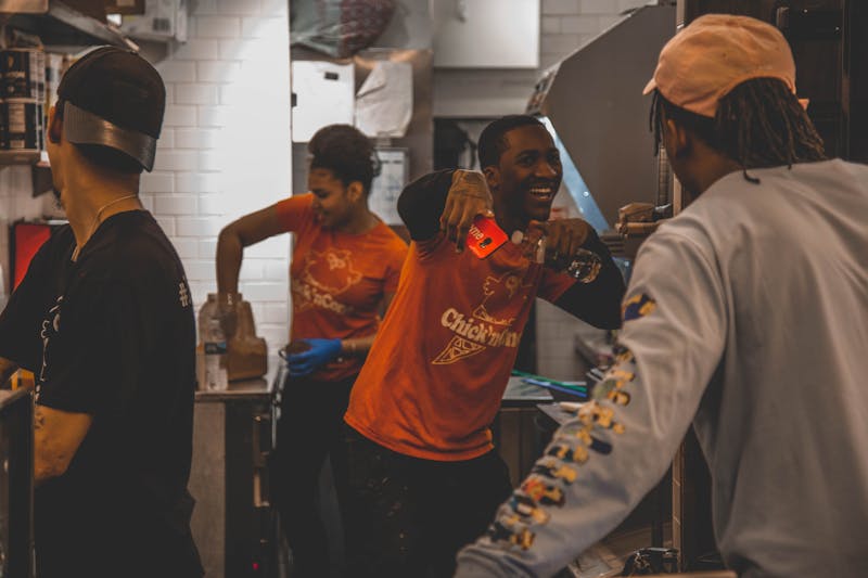 Jet's pizza team working together in restaurant